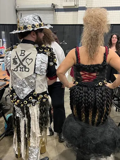 Back view of sustainable fashion designs made from recycled hair, foils, and salon materials by Baddhare Salon in Myrtle Beach